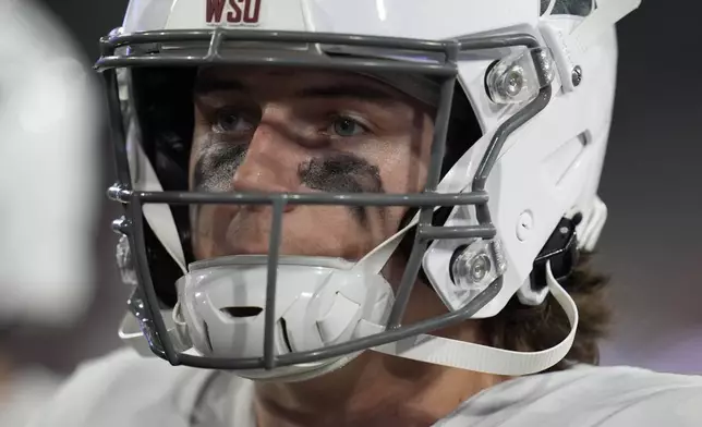 Washington State quarterback John Mateer looks on during the first half of an NCAA college football game against San Diego State Saturday, Oct. 26, 2024, in San Diego. (AP Photo/Gregory Bull)