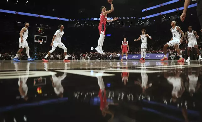 Washington Wizards forward Patrick Baldwin Jr. puts up a floater in the first half during a preseason NBA basketball game against the Brooklyn Nets, Monday, Oct. 14, 2024, in New York. (AP Photo/Heather Khalifa)