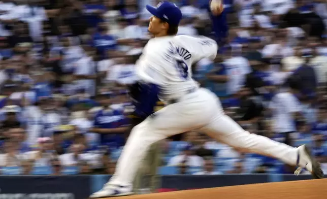 Los Angeles Dodgers starting pitcher Yoshinobu Yamamoto throws to a San Diego Padres batter during the first inning in Game 5 of a baseball NL Division Series Friday, Oct. 11, 2024, in Los Angeles. (AP Photo/Mark J. Terrill)