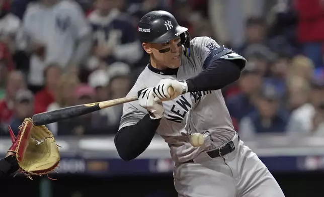 New York Yankees' Aaron Judge is hit by a pitch thrown by Cleveland Guardians starting pitcher Tanner Bibee during the first inning in Game 5 of the baseball AL Championship Series Saturday, Oct. 19, 2024, in Cleveland. (AP Photo/Godofredo A. Vásquez)