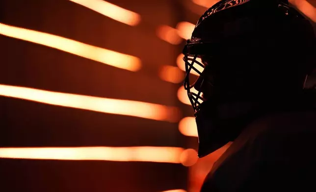 Philadelphia Flyers' Samuel Ersson waits to warm up before a preseason NHL hockey game against the New York Islanders, Thursday, Sept. 26, 2024, in Philadelphia. (AP Photo/Matt Slocum)