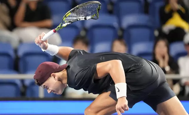 Holger Rune of Denmark smashes his racket in frustration during his men's singles semifinal match against Arthur Fils of France at the Japan Open tennis tournament on Monday, Sept. 30, 2024, at Ariake Colosseum, in Tokyo, Japan. (AP Photo/Eugene Hoshiko)