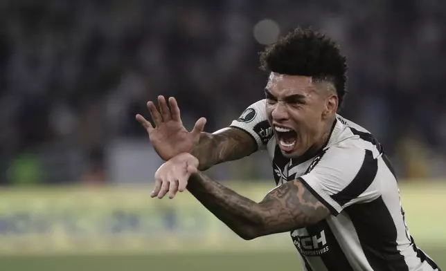 Igor Jesus of Brazil's Botafogo celebrates after scoring his side's fifth goal against Uruguay's Penarol during a Copa Libertadores semifinal first leg soccer match at Nilton Santos stadium in Rio de Janeiro, Wednesday, Oct. 23, 2024. (AP Photo/Bruna Prado)