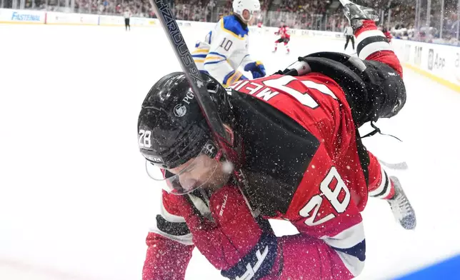 New Jersey Devils' Timo Meier battles for the puck during the NHL hockey game between Buffalo Sabres and New Jersey Devils, in Prague, Czech Republic, Friday, Oct. 4, 2024. (AP Photo/Petr David Josek)