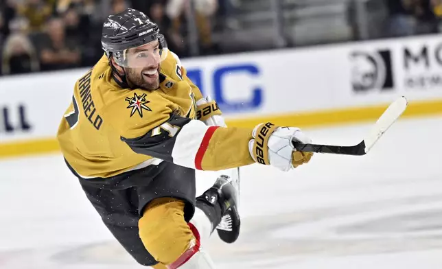 Vegas Golden Knights defenseman Alex Pietrangelo takes a shot against the St. Louis Blues during the second period of an NHL hockey game Friday, Oct. 11, 2024, in Las Vegas. (AP Photo/David Becker)