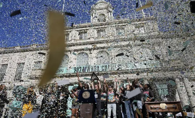 The New York Liberty, their supporters, local officials and others celebrate during a ceremony after a parade in honor of the Liberty's WNBA basketball championship at City Hall in New York, Thursday, Oct. 24, 2024. (AP Photo/Seth Wenig)