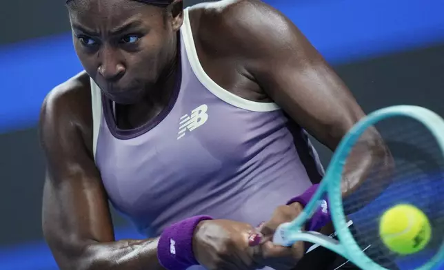 Coco Gauff of the United States returns a backhand shot to Katie Boulter of Great Britain during their women's singles match of the China Open tennis tournament, at the National Tennis Center in Beijing, Sunday, Sept. 29, 2024. (AP Photo/Andy Wong)