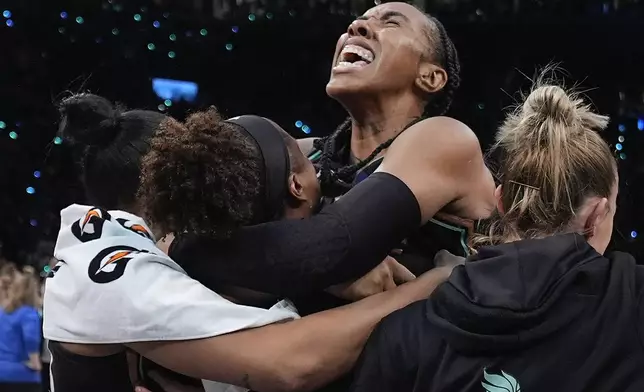 The New York Liberty celebrate after defeating the Minnesota Lynx in Game 5 of the WNBA basketball final series to win the WNBA championship, Sunday, Oct. 20, 2024, in New York. (AP Photo/Pamela Smith)