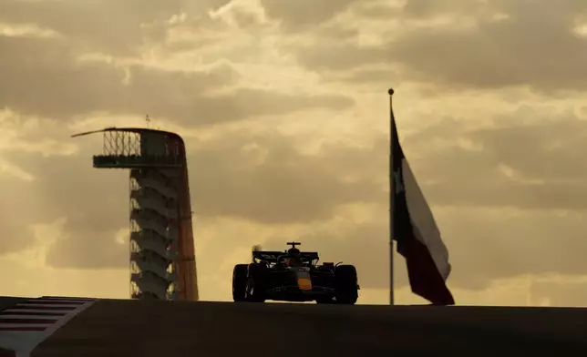 Red Bull driver Max Verstappen, of the Netherlands, tops a hill during a qualifying session for the Formula One U.S. Grand Prix auto race at Circuit of the Americas, Saturday, Oct. 19, 2024, in Austin, Texas. (AP Photo/Eric Gay)