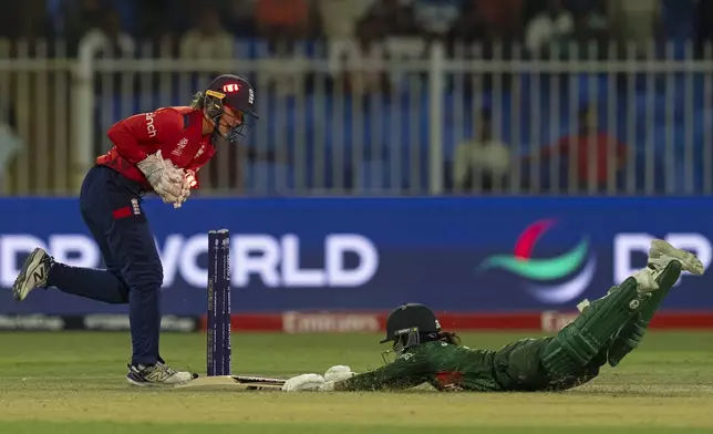 England's wicketkeeper Amy Jones runs out Bangladesh's captain Nigar Sultana during the ICC Women's T20 World Cup 2024 match between England and Bangladesh at Sharjah Stadium, United Arab Emirates, Saturday, Oct. 5, 2024. (AP Photo/Altaf Qadri)