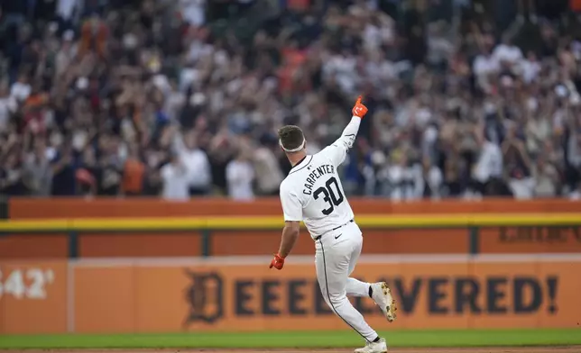 Detroit Tigers' Kerry Carpenter celebrates his grand slam against the Chicago White Sox in the fifth inning of a baseball game, Sunday, Sept. 29, 2024, in Detroit. (AP Photo/Paul Sancya)