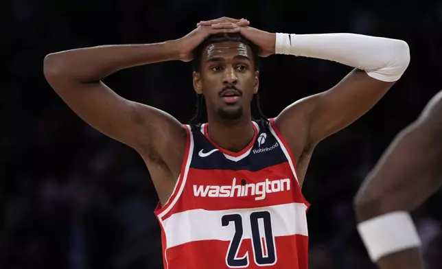 Washington Wizards' Alex Sarr stands on the court during the first half of a preseason NBA basketball game against the New York Knicks, Wednesday, Oct. 9, 2024, in New York. (AP Photo/Pamela Smith)