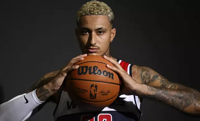 Washington Wizards forward Kyle Kuzma poses during the NBA basketball team's media day, Monday, Sept. 30, 2024, in Washington. (AP Photo/Nick Wass)