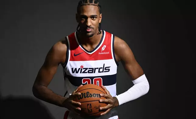 Washington Wizards forward Alex Sarr poses during the NBA basketball team's media day, Monday, Sept. 30, 2024, in Washington. (AP Photo/Nick Wass)