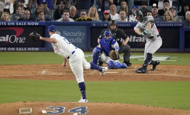 New York Yankees' Giancarlo Stanton connects for a two-run home off Los Angeles Dodgers starting pitcher Jack Flaherty during the sixth inning in Game 1 of the baseball World Series, Friday, Oct. 25, 2024, in Los Angeles. (AP Photo/Mark J. Terrill)