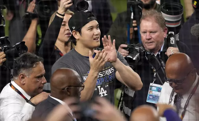 Los Angeles Dodgers' Shohei Ohtani celebrates after the Dodgers beat the New York Yankees in Game 5 to win the baseball World Series, Thursday, Oct. 31, 2024, in New York. (AP Photo/Seth Wenig)