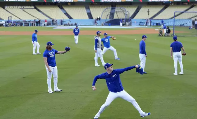 Los Angeles Dodgers pitcher Jack Flaherty warms up during batting practice during media day for the baseball World Series against the New York Yankees, Thursday, Oct. 24, 2024, in Los Angeles. (AP Photo/Ashley Landis)