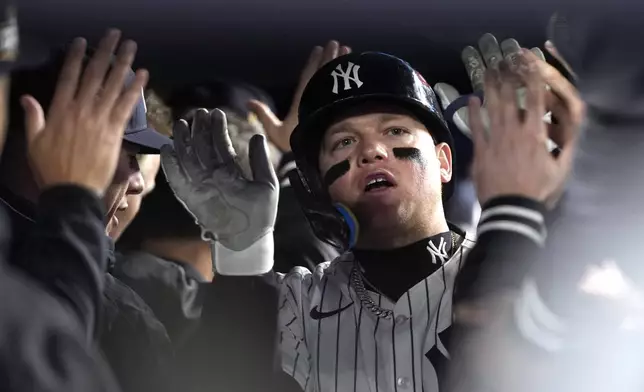 New York Yankees' Alex Verdugo celebrates in teh dugout after hitting a two-run home run against the Los Angeles Dodgers during the ninth inning in Game 3 of the baseball World Series, Monday, Oct. 28, 2024, in New York. The Dodgers won 4-2. (AP Photo/Godofredo A. Vásquez)