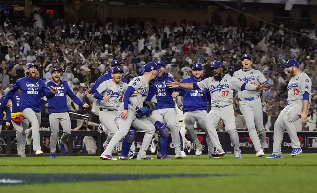 The Los Angeles Dodgers celebrate their win against the New York Yankees in Game 5 to win the baseball World Series, Wednesday, Oct. 30, 2024, in New York. (AP Photo/Godofredo A. Vásquez)