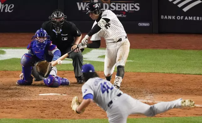 New York Yankees' Anthony Volpe doubles against the Los Angeles Dodgers during the eighth inning in Game 4 of the baseball World Series, Tuesday, Oct. 29, 2024, in New York. (AP Photo/Frank Franklin II)