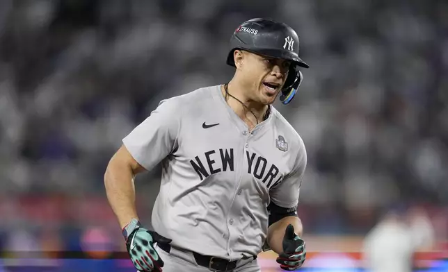 New York Yankees' Giancarlo Stanton runs the bases after hitting a two-run home run against the Los Angeles Dodgers during the sixth inning in Game 1 of the baseball World Series, Friday, Oct. 25, 2024, in Los Angeles. (AP Photo/Godofredo A. Vásquez)