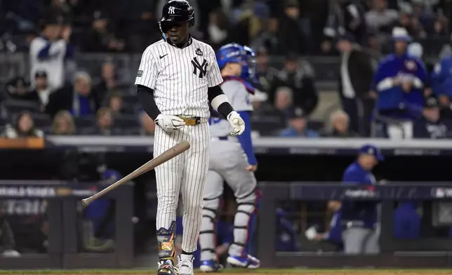 New York Yankees' Jazz Chisholm Jr. throws his bat after striking out to end the eighth inning in Game 3 of the baseball World Series against the Los Angeles Dodgers, Monday, Oct. 28, 2024, in New York. (AP Photo/Godofredo A. Vásquez)