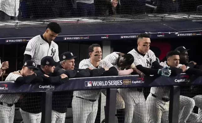 The New York Yankees watch during their loss against the Los Angeles Dodgers in Game 5 of the baseball World Series, Wednesday, Oct. 30, 2024, in New York. (AP Photo/Frank Franklin II)