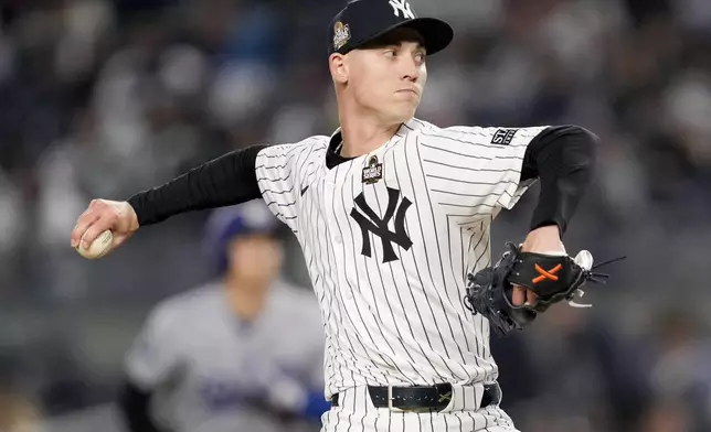 New York Yankees pitcher Luke Weaver throws against the Los Angeles Dodgers during the ninth inning in Game 3 of the baseball World Series, Monday, Oct. 28, 2024, in New York. (AP Photo/Ashley Landis)