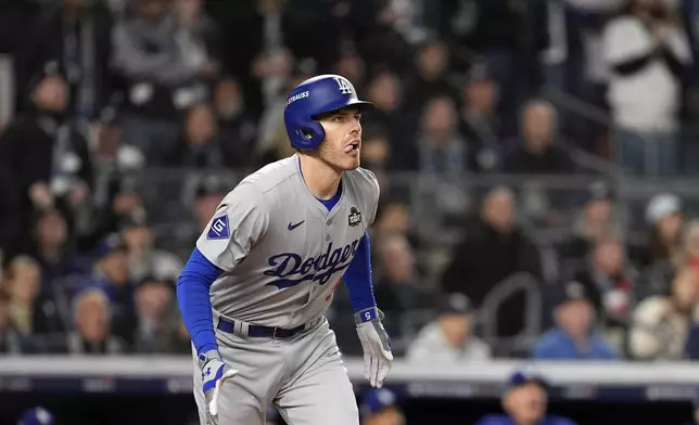 Los Angeles Dodgers' Freddie Freeman watches his two-run home run against the New York Yankees during the first inning in Game 3 of the baseball World Series, Monday, Oct. 28, 2024, in New York. (AP Photo/Godofredo A. Vásquez)