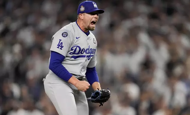 Los Angeles Dodgers pitcher Blake Treinen celebrates the end of the eighth inning in Game 5 of the baseball World Series against the New York Yankees, Wednesday, Oct. 30, 2024, in New York. (AP Photo/Ashley Landis)