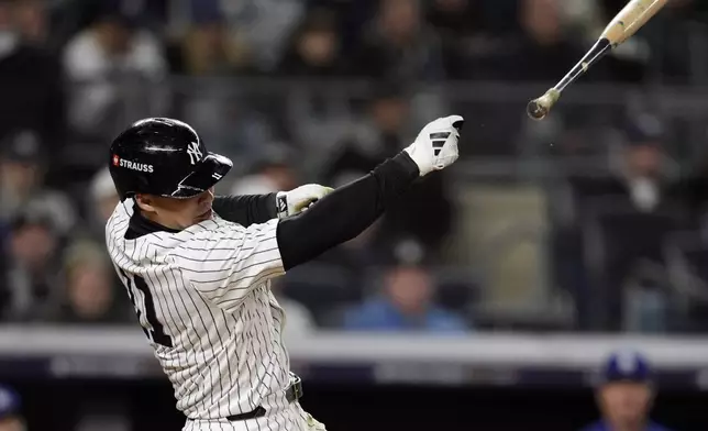 New York Yankees' Anthony Volpe loses his bat as he swings for strike-three during the seventh inning in Game 3 of the baseball World Series against the Los Angeles Dodgers, Monday, Oct. 28, 2024, in New York. (AP Photo/Godofredo A. Vásquez)