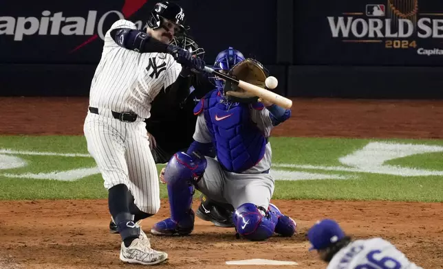 New York Yankees' Austin Wells hits home run against the Los Angeles Dodgers during the sixth inning in Game 4 of the baseball World Series, Tuesday, Oct. 29, 2024, in New York. (AP Photo/Frank Franklin II)