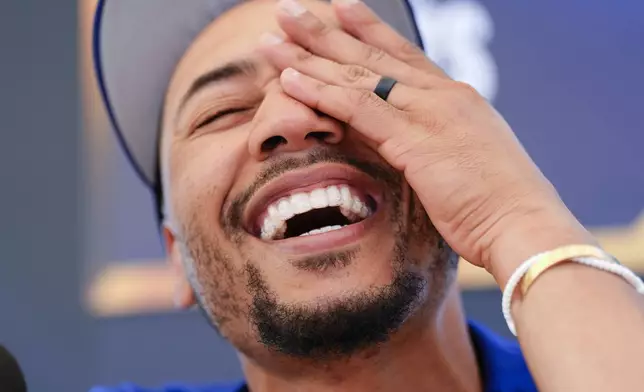 Los Angeles Dodgers' Mookie Betts speaks during media day for the baseball World Series, Thursday, Oct. 24, 2024, in Los Angeles. (AP Photo/Julio Cortez)