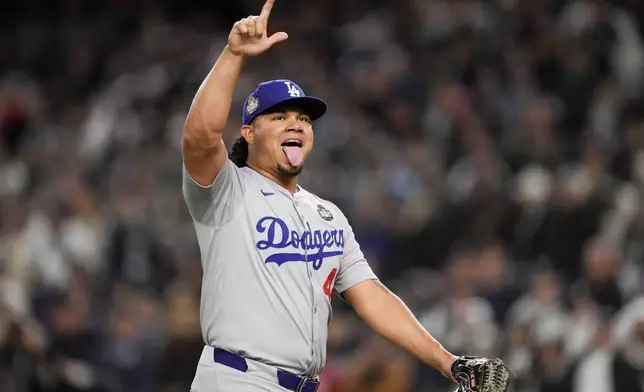 Los Angeles Dodgers pitcher Brusdar Graterol celebrates against the New York Yankees during the sixth inning in Game 3 of the baseball World Series, Monday, Oct. 28, 2024, in New York. (AP Photo/Ashley Landis)