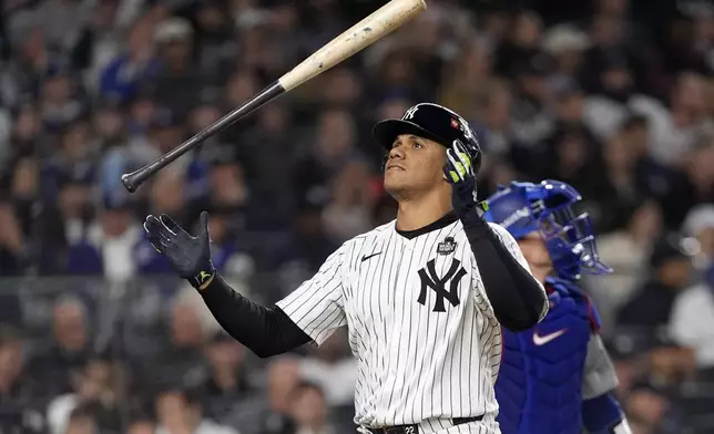 New York Yankees' Juan Soto tosses his bat after striking out against the Los Angeles Dodgers during the third inning in Game 4 of the baseball World Series, Tuesday, Oct. 29, 2024, in New York. (AP Photo/Godofredo A. Vásquez)