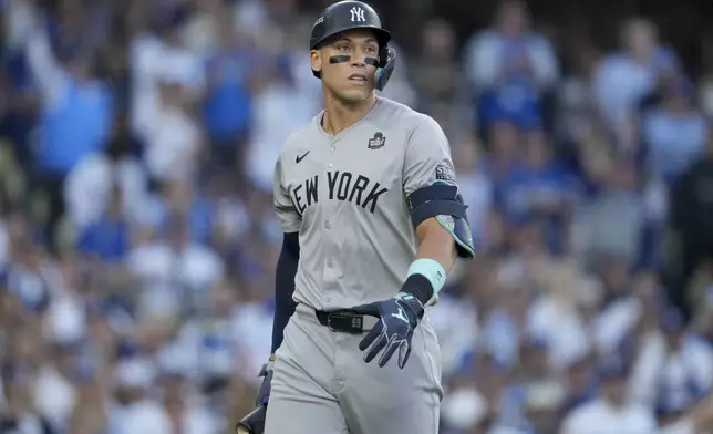 New York Yankees' Aaron Judge reacts after striking out against the Los Angeles Dodgers during the first inning in Game 1 of the baseball World Series, Friday, Oct. 25, 2024, in Los Angeles. (AP Photo/Ashley Landis)