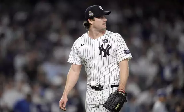 New York Yankees starting pitcher Gerrit Cole looks back toward the scoreboard after throwing against the Los Angeles Dodgers during the fifth inning in Game 5 of the baseball World Series, Wednesday, Oct. 30, 2024, in New York. (AP Photo/Godofredo A. Vásquez)