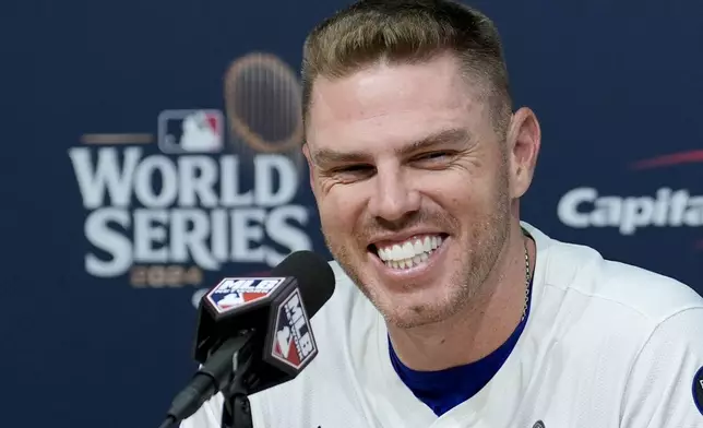 Los Angeles Dodgers' Freddie Freeman speaks during a news conference after his walk-off grand slam home run against the New York Yankees during the 10th inning in Game 1 of the baseball World Series, Friday, Oct. 25, 2024, in Los Angeles. (AP Photo/Ashley Landis)