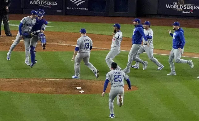 The Los Angeles Dodgers celebrate their win against the New York Yankees in Game 5 to win the baseball World Series, Wednesday, Oct. 30, 2024, in New York. (AP Photo/Frank Franklin II)