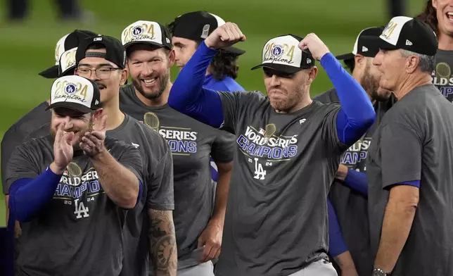 Los Angeles Dodgers' Freddie Freeman celebrates after the Dodgers beat the New York Yankees in Game 5 to win the baseball World Series, Thursday, Oct. 31, 2024, in New York. (AP Photo/Seth Wenig)