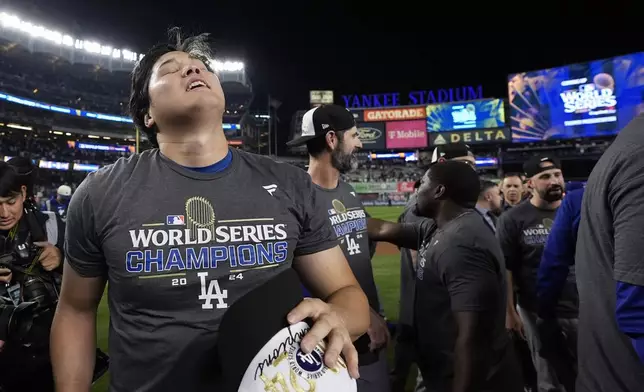 Los Angeles Dodgers' Shohei Ohtani celebrates after the Dodgers beat the New York Yankees in Game 5 to win the baseball World Series, Wednesday, Oct. 30, 2024, in New York. (AP Photo/Godofredo A. Vásquez)