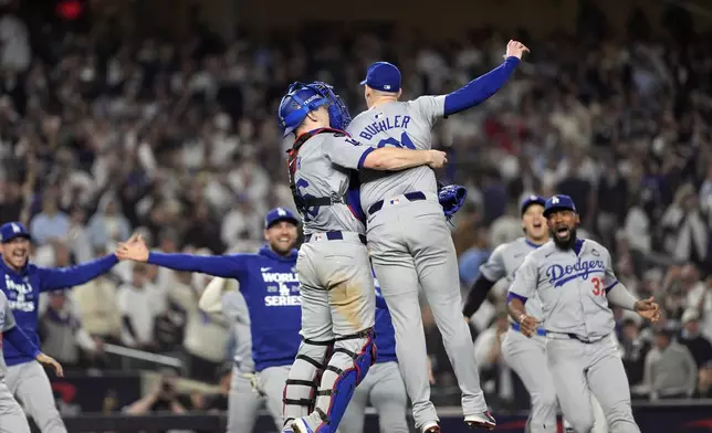 The Los Angeles Dodgers celebrate their win against the New York Yankees in Game 5 to win the baseball World Series, Wednesday, Oct. 30, 2024, in New York. (AP Photo/Godofredo A. Vásquez)