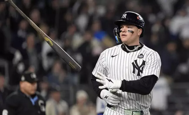 New York Yankees' Alex Verdugo tosses his bat after hitting a two-run home run against the Los Angeles Dodgers during the ninth inning in Game 3 of the baseball World Series, Monday, Oct. 28, 2024, in New York. (AP Photo/Godofredo A. Vásquez)