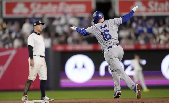 Los Angeles Dodgers' Will Smith (16) celebrates after hitting a home run against the New York Yankees during the fifth inning in Game 4 of the baseball World Series, Tuesday, Oct. 29, 2024, in New York. (AP Photo/Godofredo A. Vásquez)