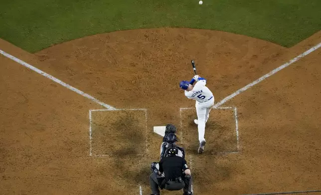 Los Angeles Dodgers' Freddie Freeman connects for a walk-off grand slam home run during the 10th inning in Game 1 of the baseball World Series against the New York Yankees, Friday, Oct. 25, 2024, in Los Angeles. (AP Photo/Mark J. Terrill)