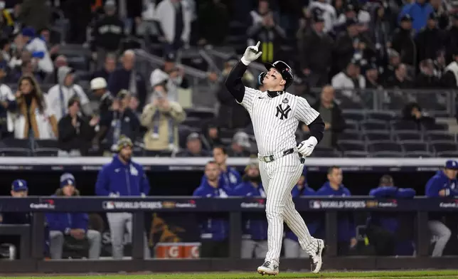 New York Yankees' Alex Verdugo celebrates after hitting a two-run home run against the Los Angeles Dodgers during the ninth inning in Game 3 of the baseball World Series, Monday, Oct. 28, 2024, in New York. (AP Photo/Godofredo A. Vásquez)