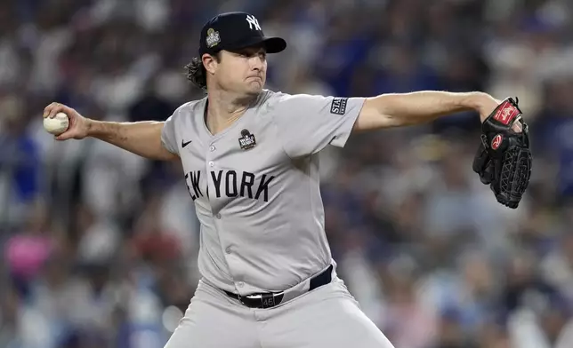 New York Yankees pitcher Gerrit Cole throws against the Los Angeles Dodgers during the sixth inning in Game 1 of the baseball World Series, Friday, Oct. 25, 2024, in Los Angeles. (AP Photo/Godofredo A. Vásquez)