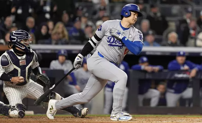 Los Angeles Dodgers' Shohei Ohtani strikes out against the New York Yankees during the fourth inning in Game 3 of the baseball World Series, Monday, Oct. 28, 2024, in New York. (AP Photo/Godofredo A. Vásquez)