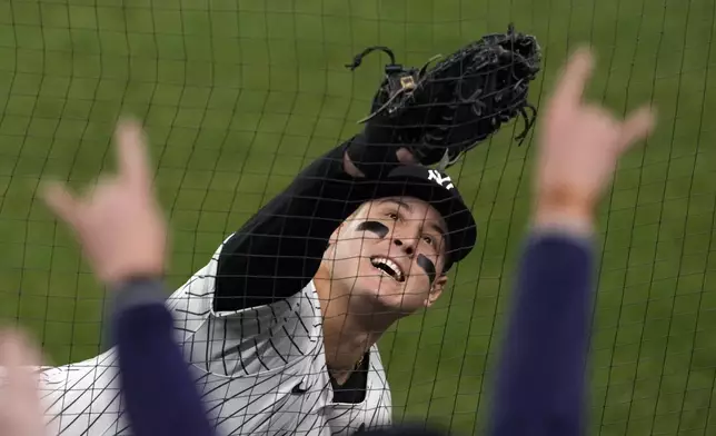 New York Yankees first baseman Anthony Rizzo catches a foul ball by Los Angeles Dodgers' Teoscar Hernández during the fourth inning in Game 4 of the baseball World Series, Tuesday, Oct. 29, 2024, in New York. (AP Photo/Seth Wenig)