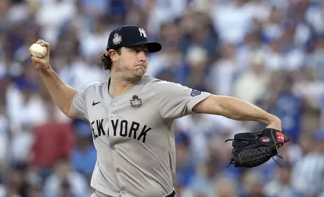 New York Yankees starting pitcher Gerrit Cole throws against the Los Angeles Dodgers during the first inning in Game 1 of the baseball World Series, Friday, Oct. 25, 2024, in Los Angeles. (AP Photo/Godofredo A. Vásquez)